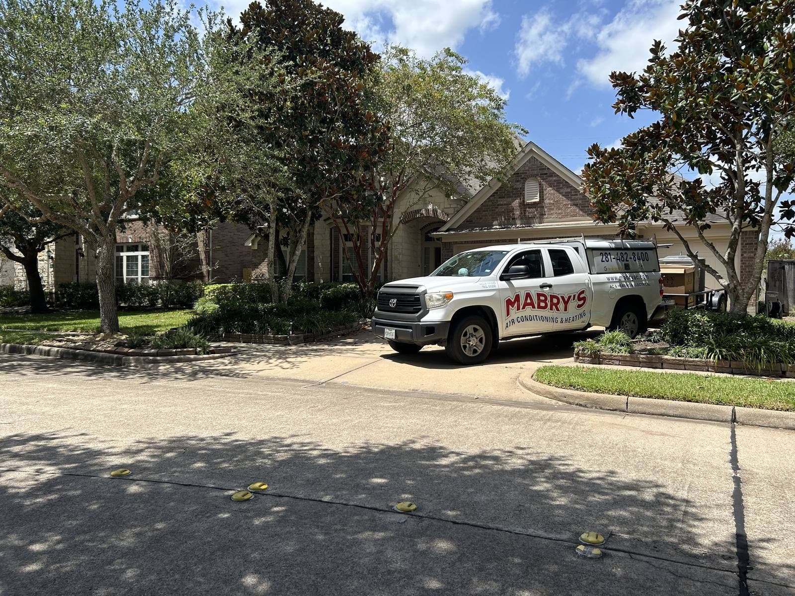 Mabry's Air Conditioning & Heating branded service truck in an Alvin, TX neighborhood