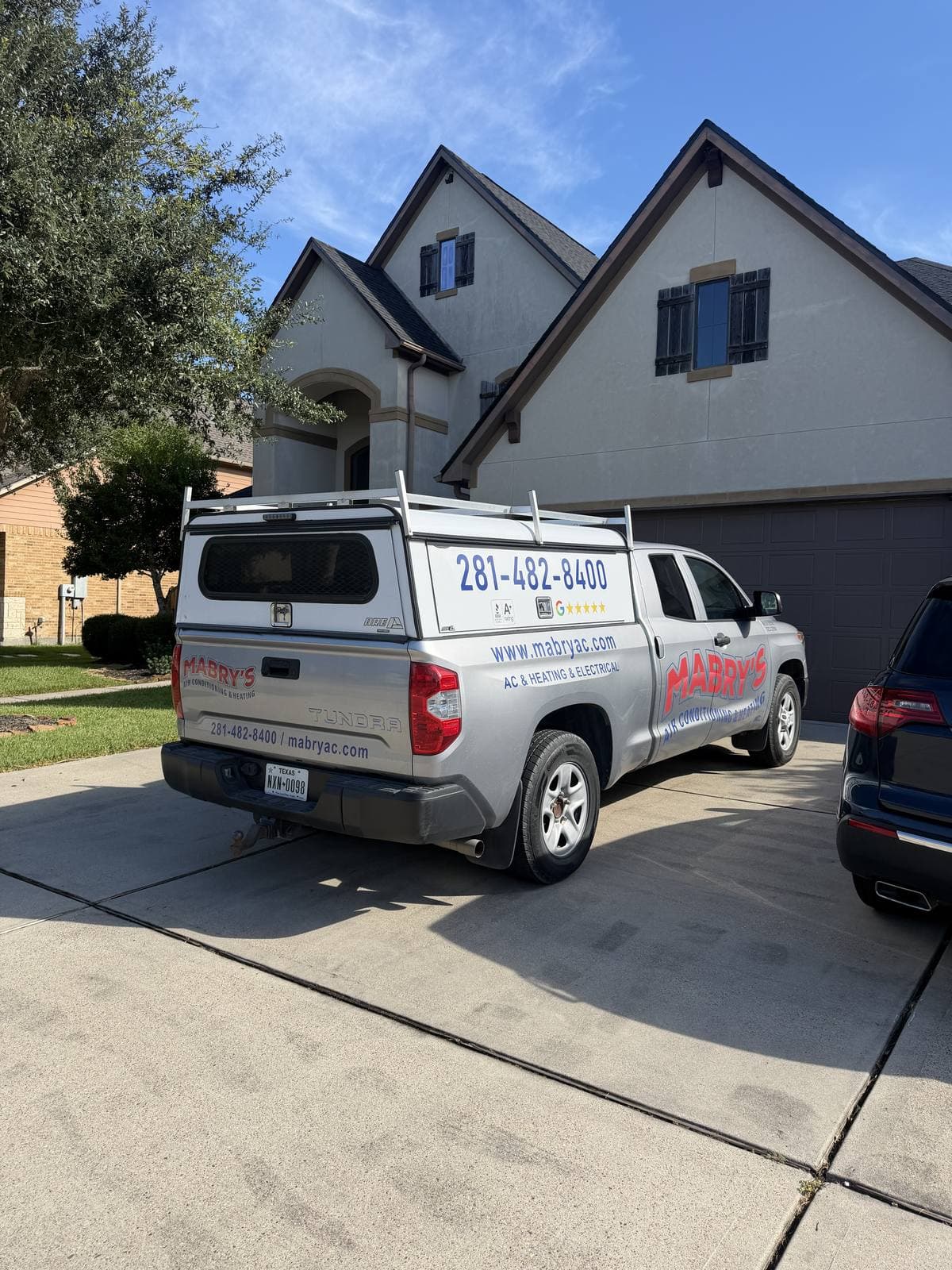 Mabry's Air Conditioning & Heating branded service truck at a Friendswood, TX home